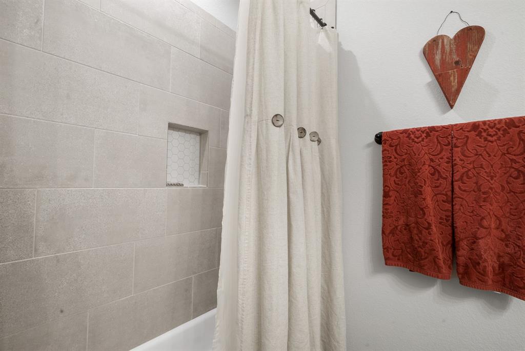 355 Sunset Cove Bluff Dale, TX 76433 - Photo 22 of 40 a bathroom with a shower