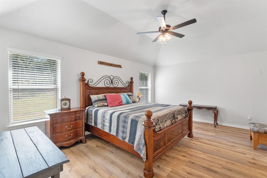 355 Sunset Cove Bluff Dale, TX 76433 - Photo 25 of 40 a bedroom with a bed and a ceiling fan