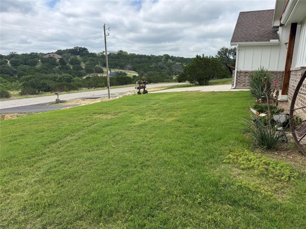 355 Sunset Cove Bluff Dale, TX 76433 - Photo 4 of 40 a view of outdoor space with garden