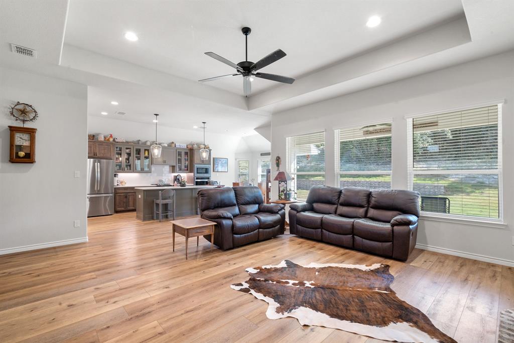 355 Sunset Cove Bluff Dale, TX 76433 - Photo 8 of 40 a living room with furniture and a large window