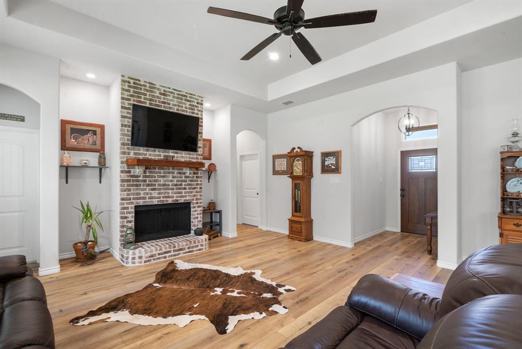 355 Sunset Cove Bluff Dale, TX 76433 - Photo 10 of 40 a bedroom with furniture and a fireplace