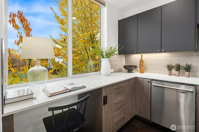 a kitchen with a sink and cabinets