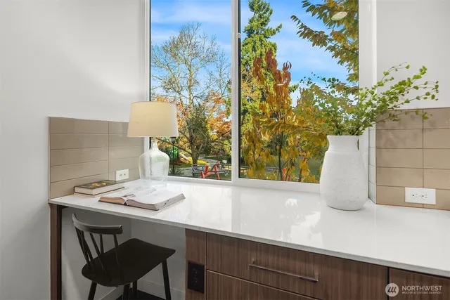a dining room with table and chairs
