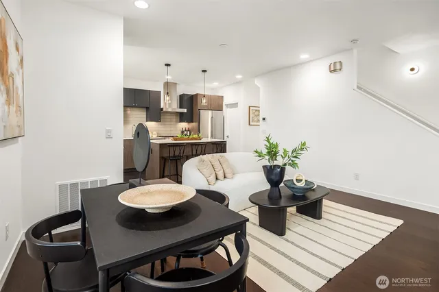 a view of a dining room with furniture and wooden floor