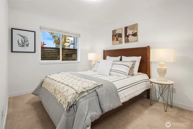 a bedroom with a bed and wall painting