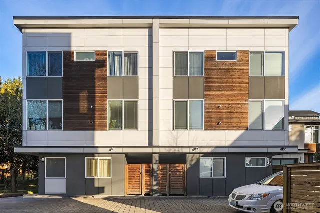 a front view of a residential apartment building with a glass door