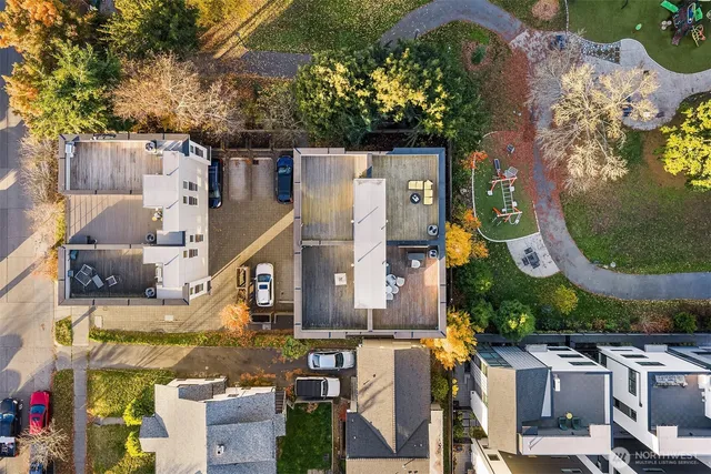 an aerial view of residential houses with outdoor space