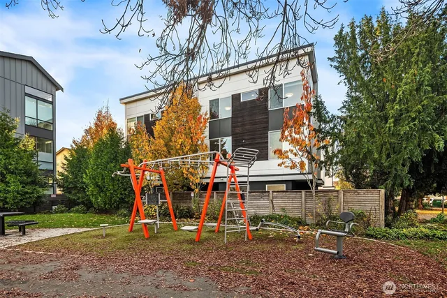 a view of outdoor space with playground and green space