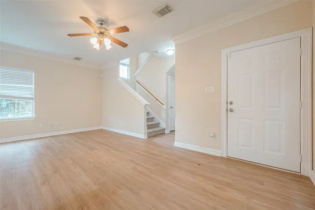 a kitchen with a sink cabinets stainless steel appliances and a window