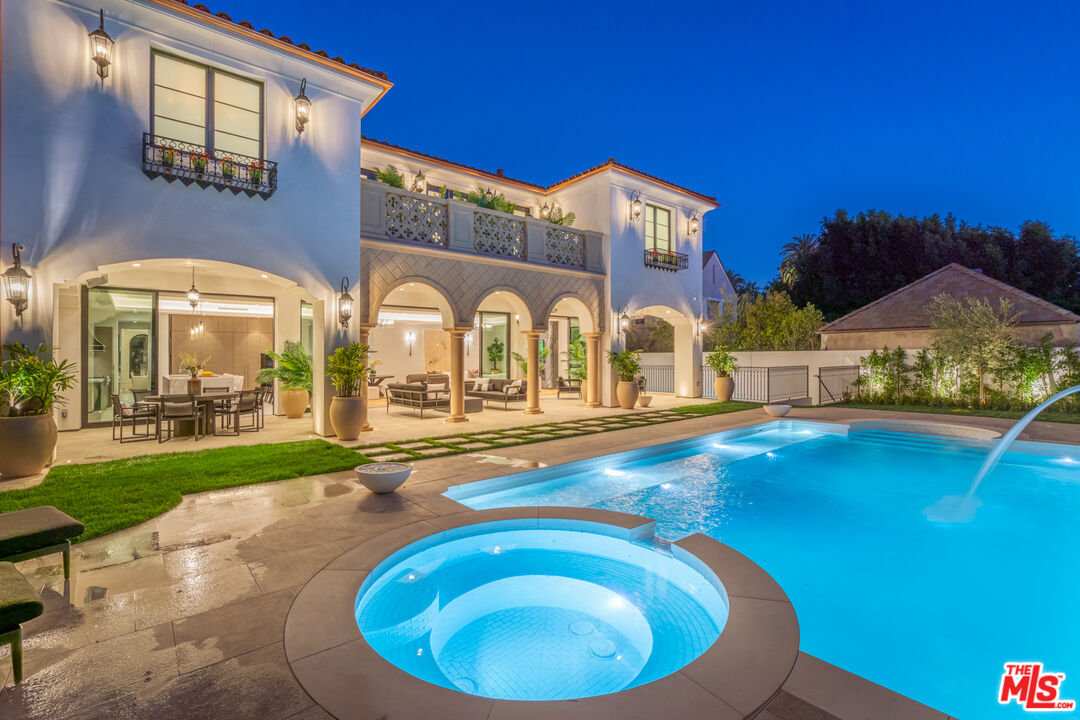 a view of swimming pool in front of residential houses