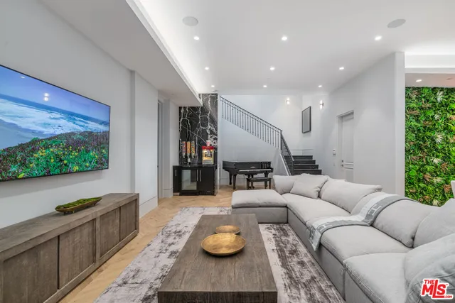 a kitchen with kitchen island granite countertop lots of counter top space and sink