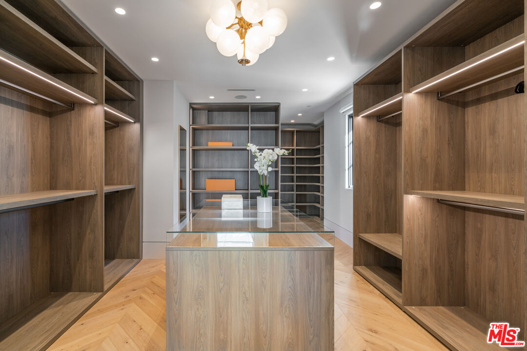 611 North Hillcrest Road Beverly Hills, CA 90210 - Photo 56 of 65 a view of walk in closet with window