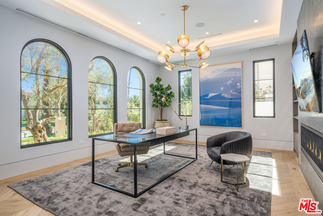 611 North Hillcrest Road Beverly Hills, CA 90210 - Photo 6 of 65 a view of a livingroom with furniture window and wooden floor