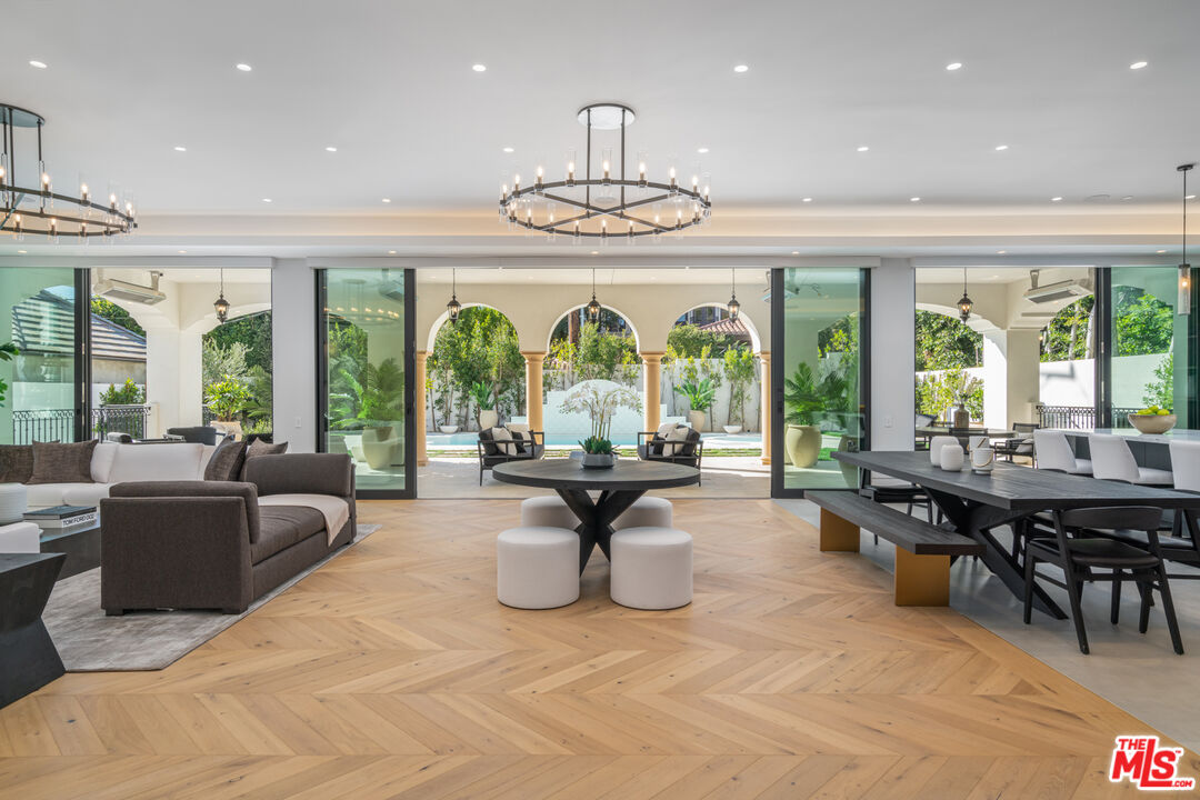 611 North Hillcrest Road Beverly Hills, CA 90210 - Photo 10 of 65 a living room with fireplace furniture and a large window