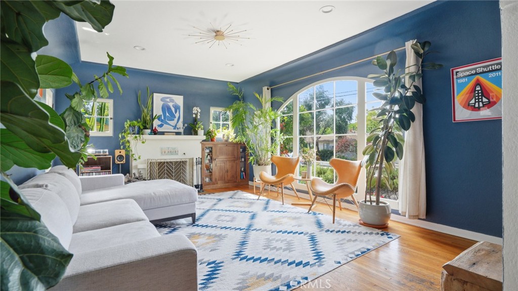 270 Clinton Street Pasadena, CA 91103 - Photo 11 of 75 a living room with furniture large windows and wooden floor