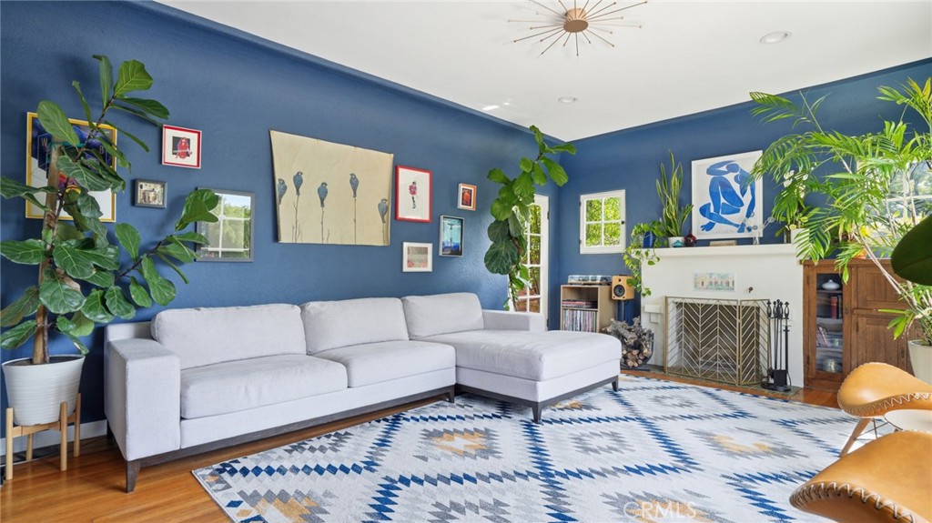270 Clinton Street Pasadena, CA 91103 - Photo 12 of 75 a living room with furniture and a fireplace