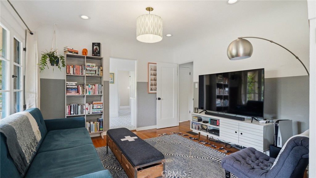 270 Clinton Street Pasadena, CA 91103 - Photo 23 of 75 a living room with furniture and a flat screen tv