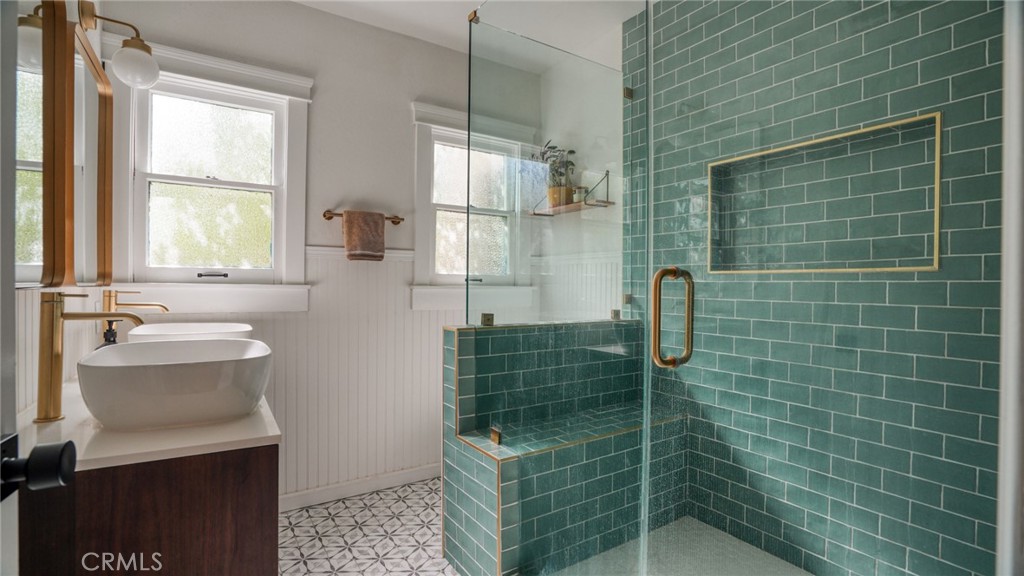 270 Clinton Street Pasadena, CA 91103 - Photo 4 of 75 a bathroom with a shower a sink and mirror