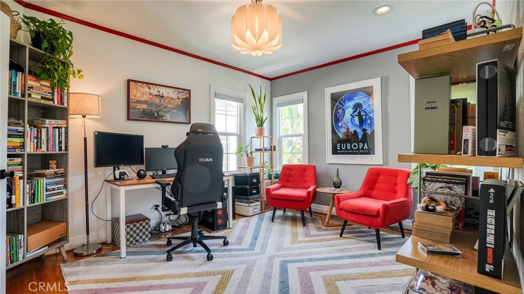 270 Clinton Street Pasadena, CA 91103 - Photo 49 of 75 a living room with furniture a flat screen tv and a fireplace