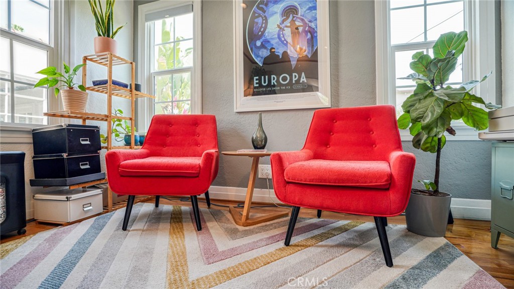 270 Clinton Street Pasadena, CA 91103 - Photo 50 of 75 a living room with furniture a rug and a potted plant