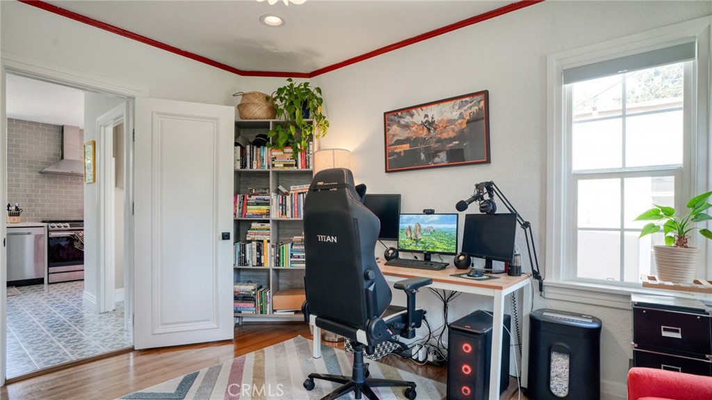 270 Clinton Street Pasadena, CA 91103 - Photo 51 of 75 a view of a workspace with furniture and a potted plant