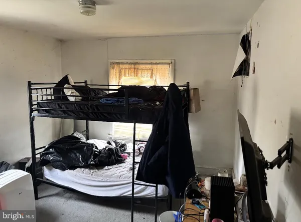 a bed room with a bed and a couch