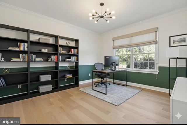 a living room with furniture and floor to ceiling windows