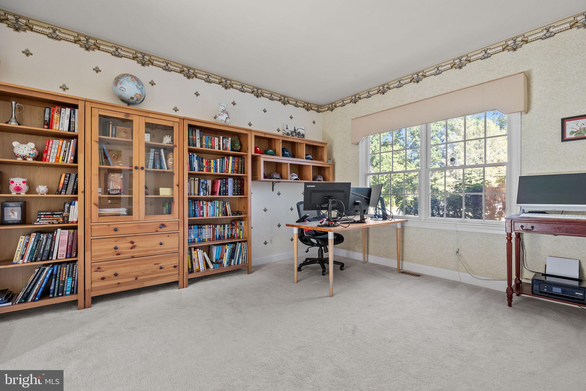 3689 Hancock Lane Doylestown, PA 18902 - Photo 14 of 78 a view of a workspace with bookshelf and a window