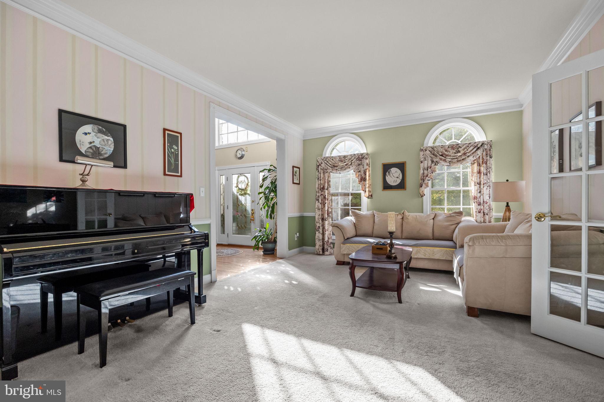 3689 Hancock Lane Doylestown, PA 18902 - Photo 3 of 78 a living room with furniture and a flat screen tv with wooden floor