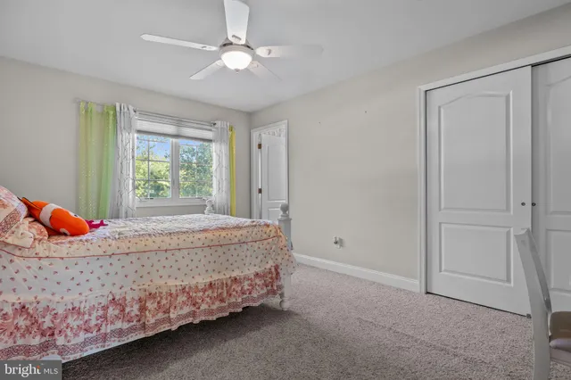 an aerial view of residential house with swimming pool and lawn chairs