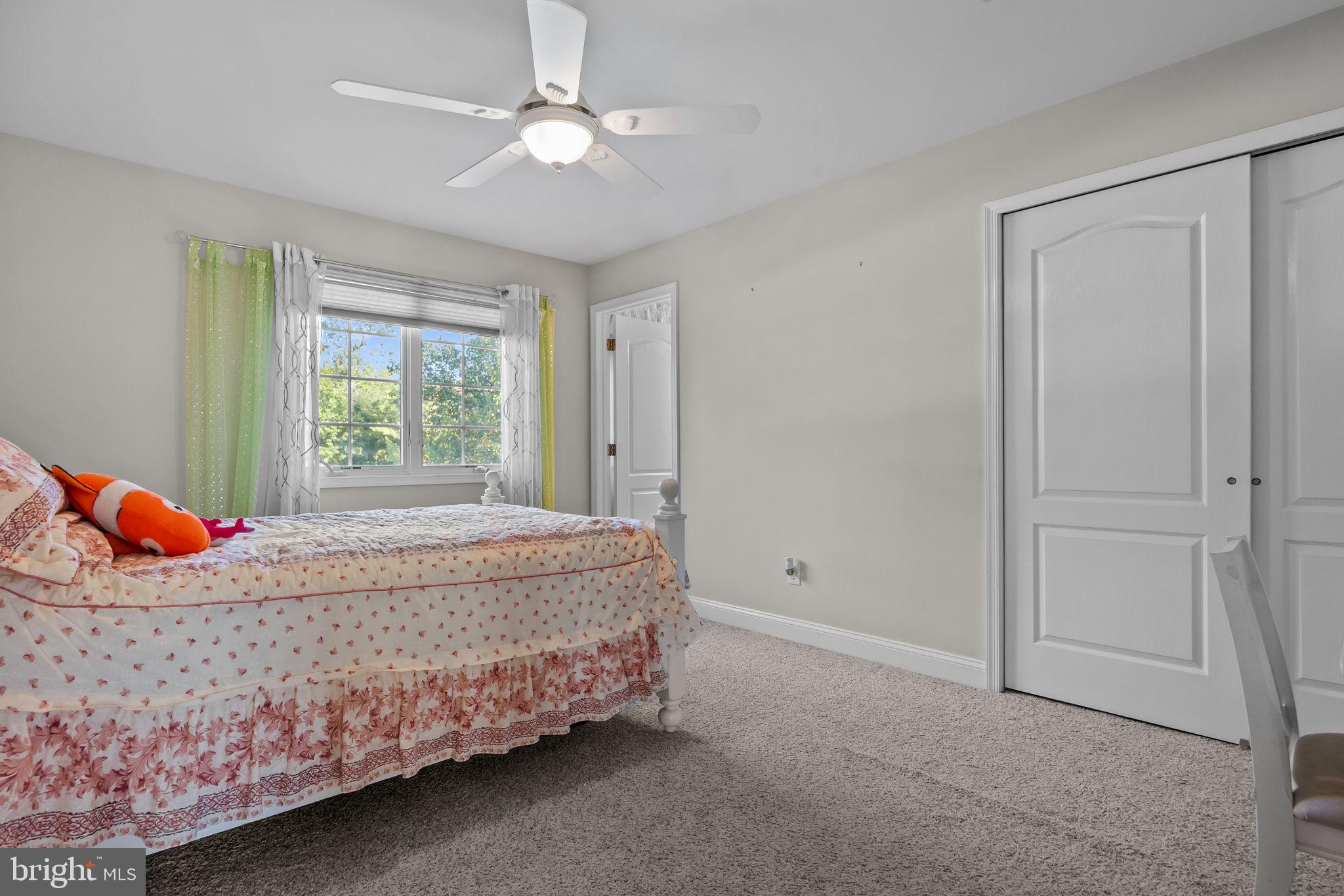 3689 Hancock Lane Doylestown, PA 18902 - Photo 36 of 78 a bedroom with a bed and a chandelier