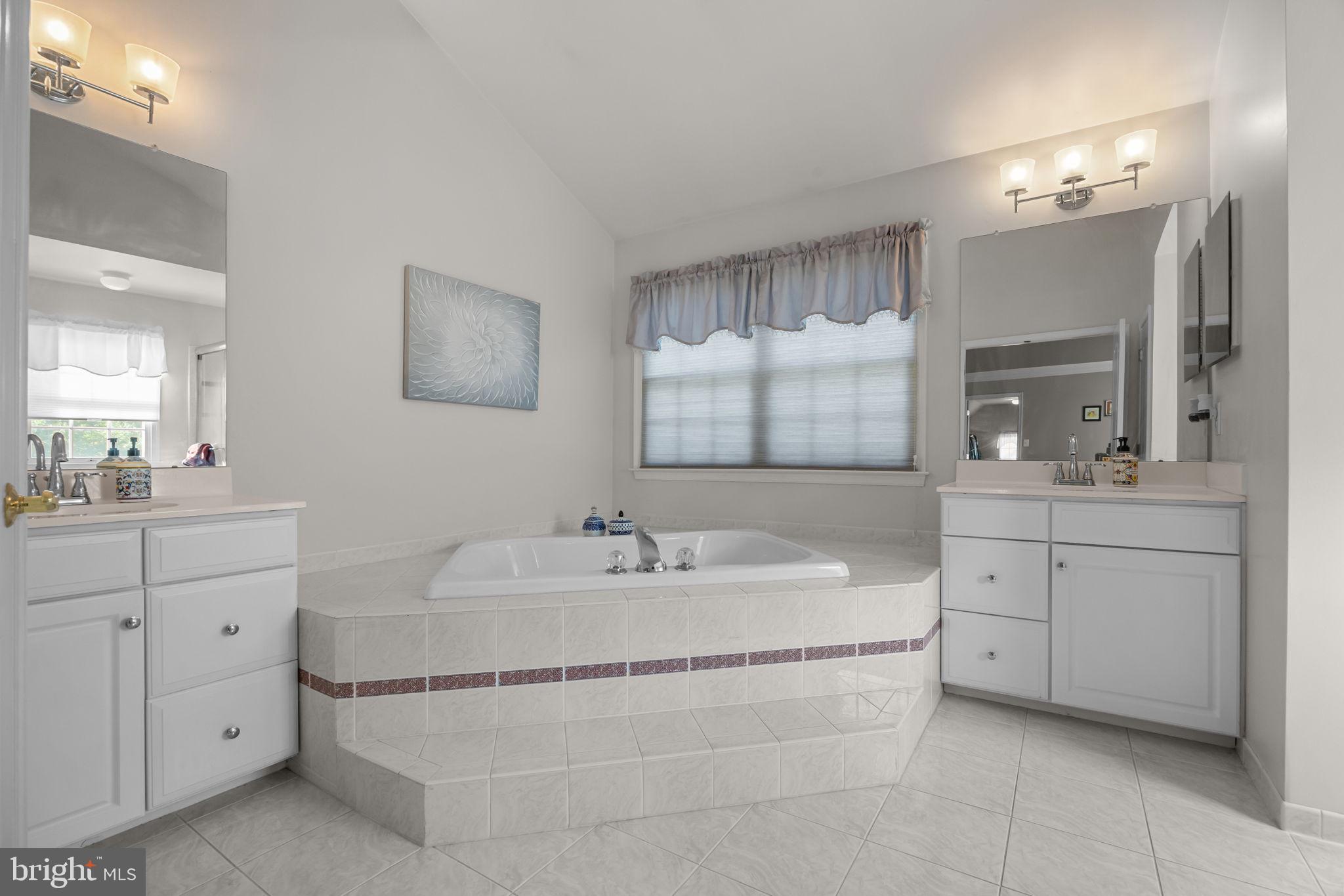 3689 Hancock Lane Doylestown, PA 18902 - Photo 44 of 78 a spacious bathroom with a double vanity sink mirror and bathtub
