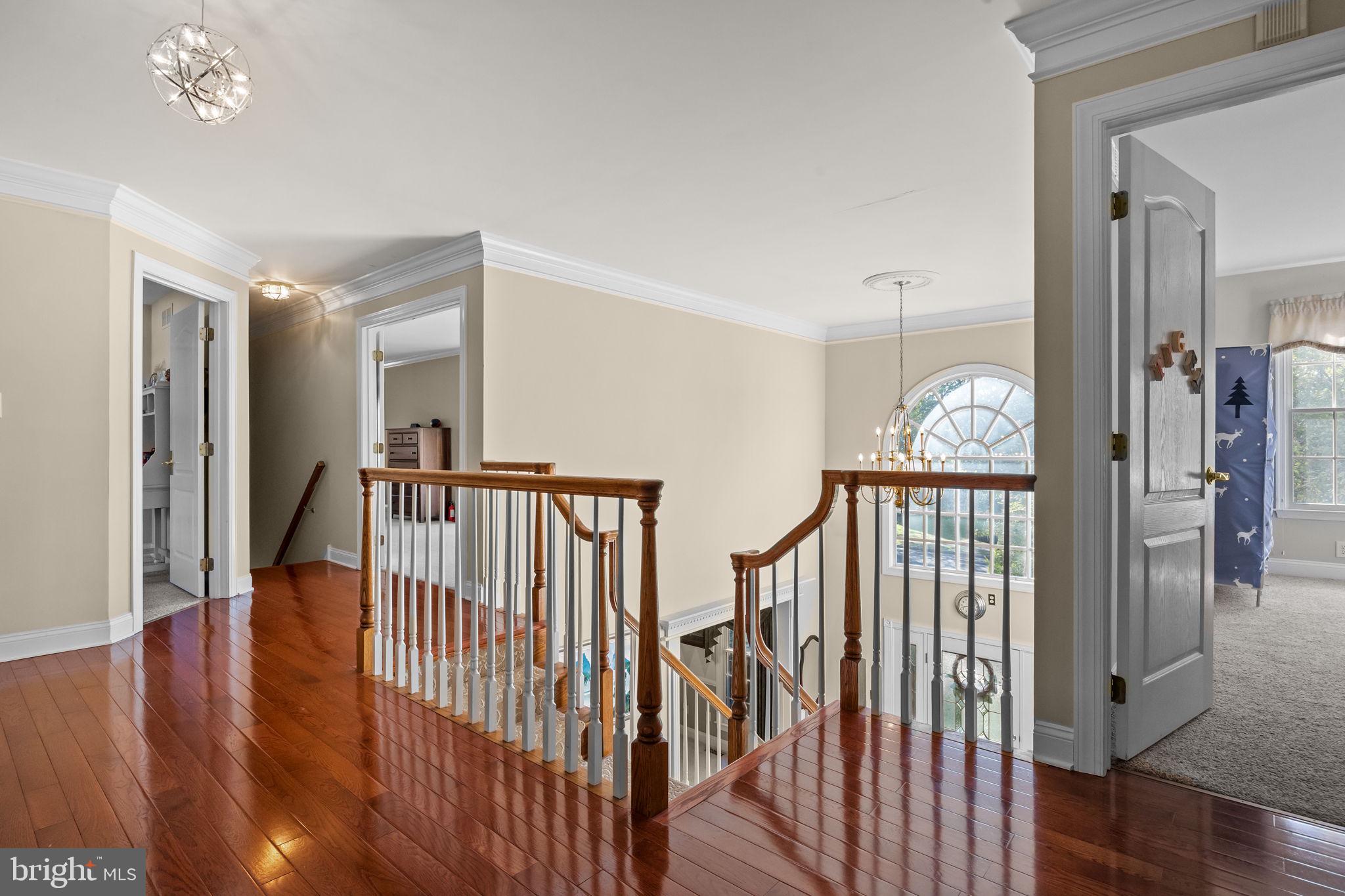 3689 Hancock Lane Doylestown, PA 18902 - Photo 47 of 78 a view of staircase with railing and a chandelier