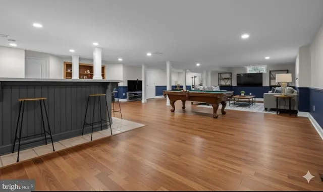 a living room with fireplace furniture and a flat screen tv