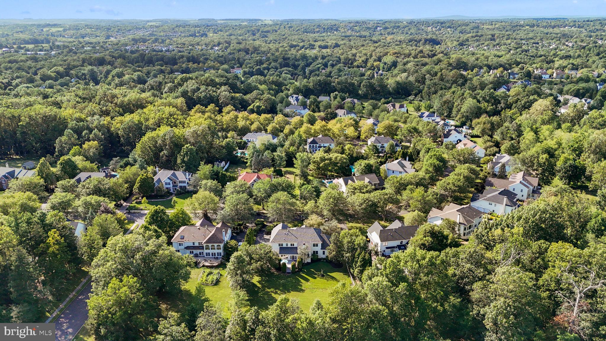 3689 Hancock Lane Doylestown, PA 18902 - Photo 72 of 78 an aerial view of a houses with a lush green hillside