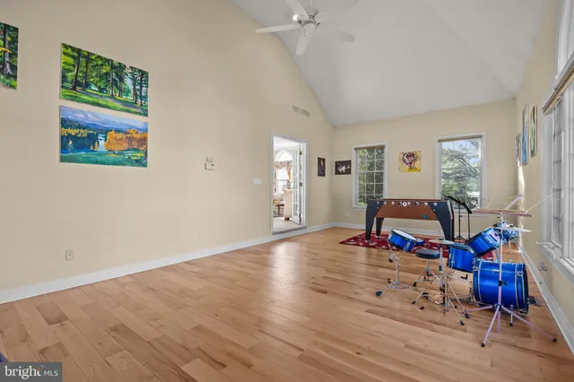 a living room with furniture staircase and a flat screen tv