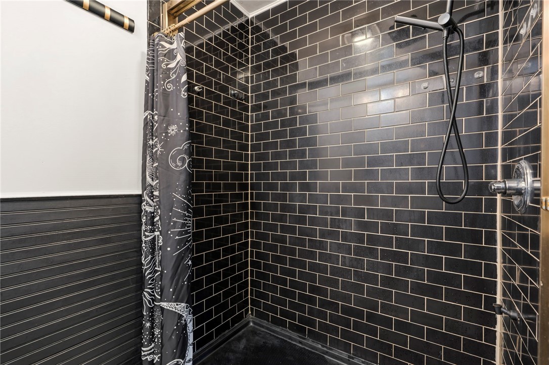122 Latham Drive Anderson, SC 29621 - Photo 18 of 40 This sleek shower features subway tile for a contemporary bathroom aesthetic.