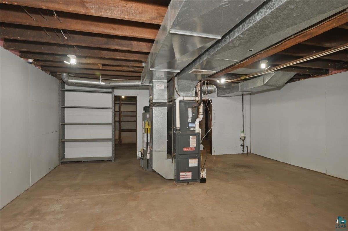 5319 East 3rd Street Superior, WI 54880 - Photo 21 of 33 Lower level utility space featuring exposed wood joists and concrete flooring