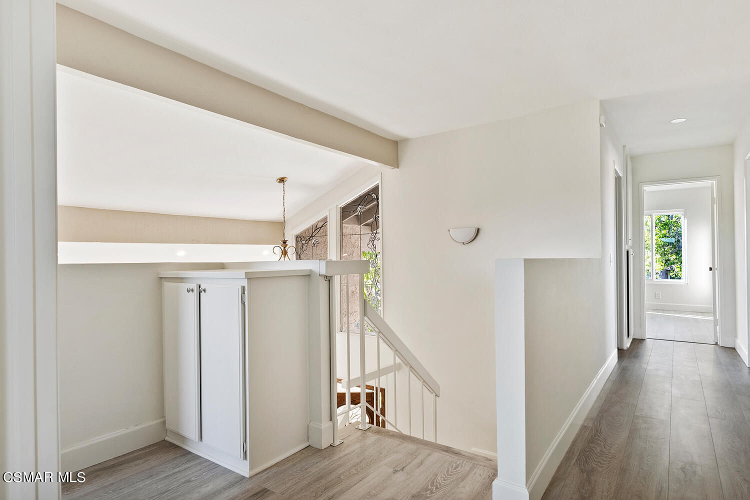 224 Cedar Heights Drive Thousand Oaks, CA 91360 - Photo 14 of 27 a view of a hallway with wooden floor and staircase
