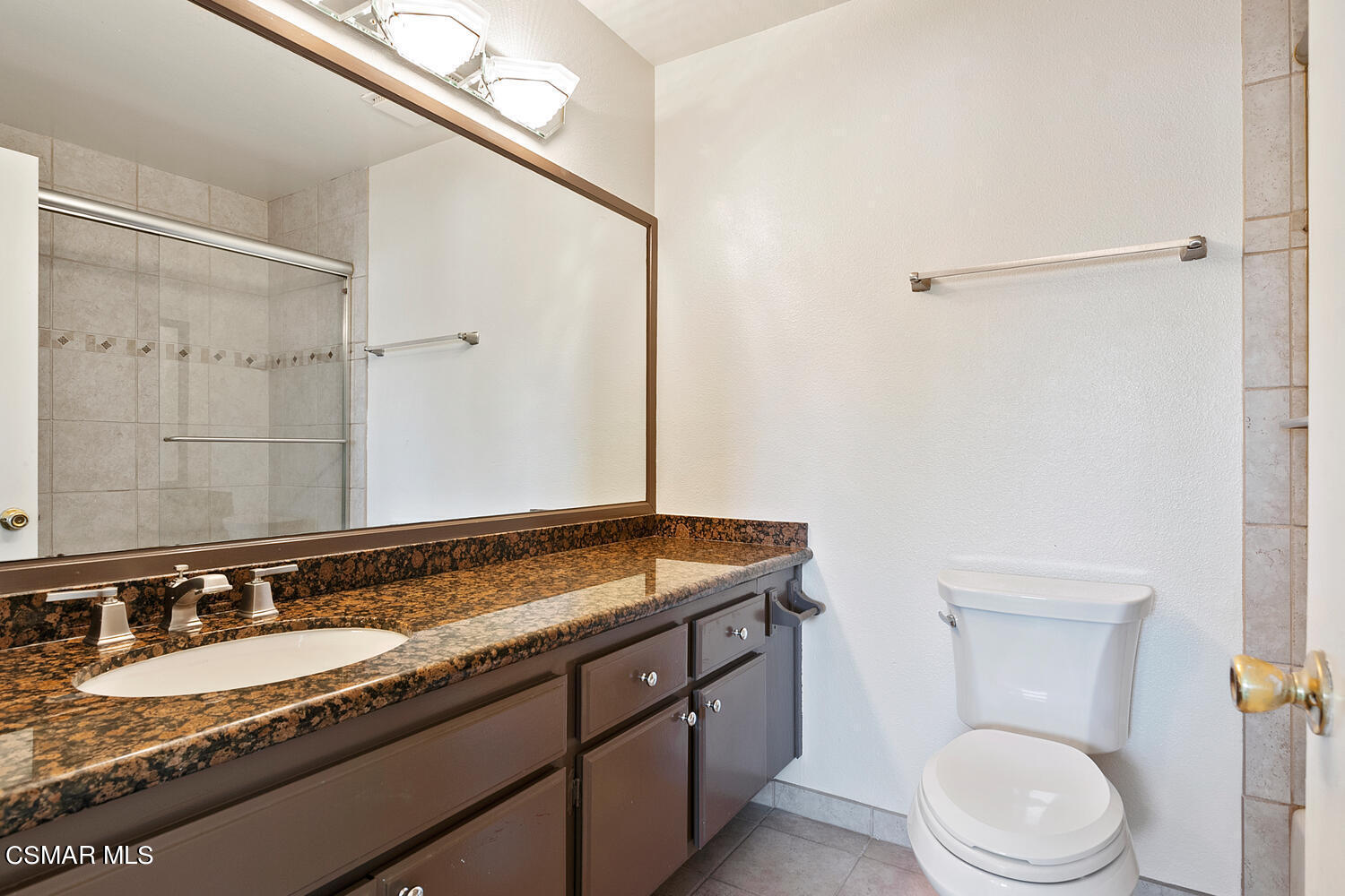 224 Cedar Heights Drive Thousand Oaks, CA 91360 - Photo 20 of 27 a bathroom with a granite countertop sink toilet and shower