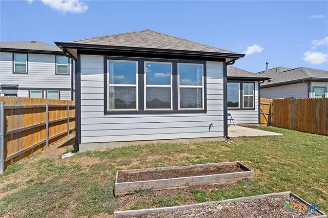 a house with swimming pool in front of it