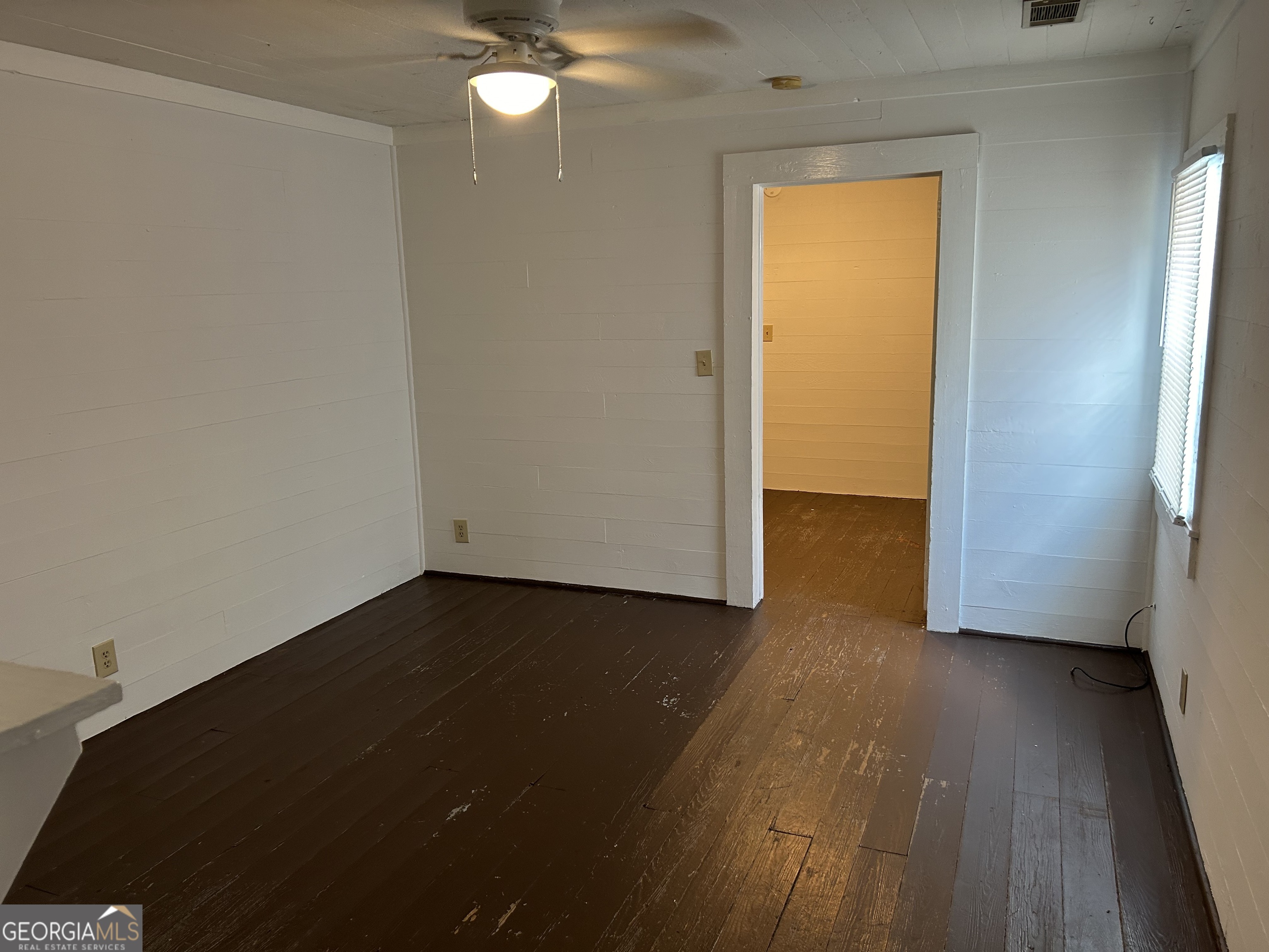 433 South Rocksprings Street Athens, GA 30605 - Photo 6 of 14 an empty room with wooden floor and closet