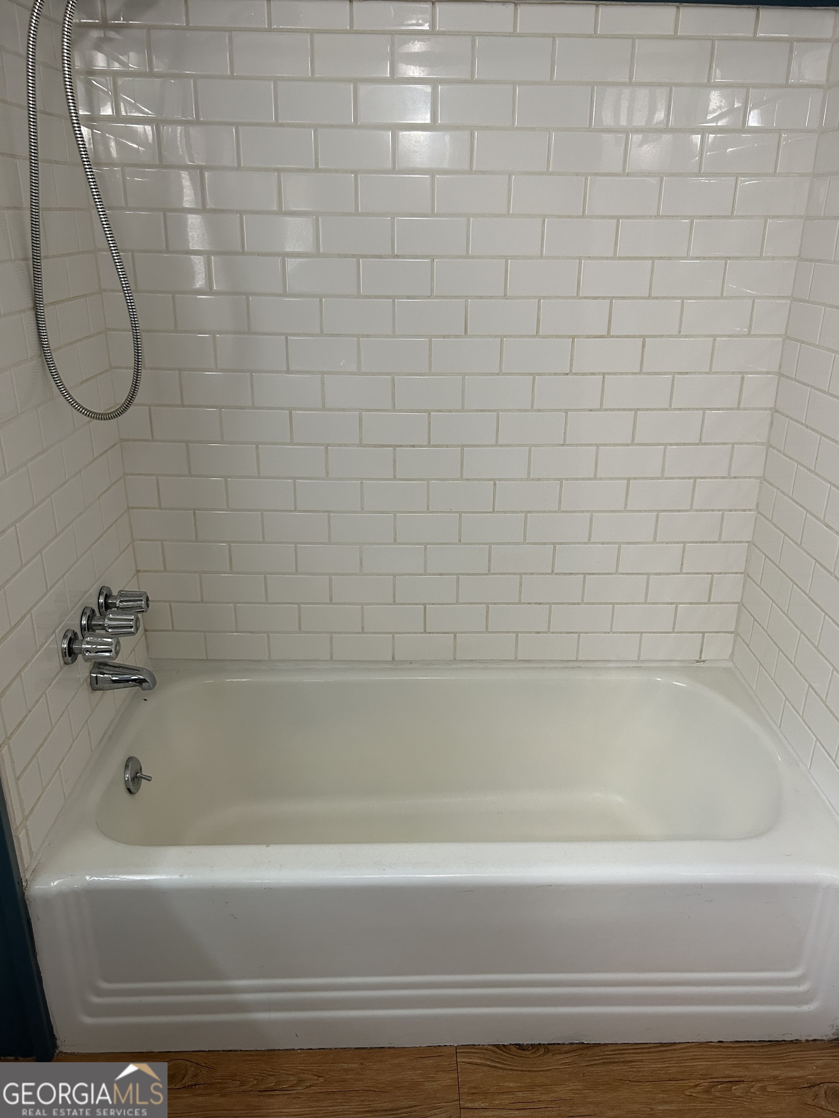 433 South Rocksprings Street Athens, GA 30605 - Photo 9 of 14 a bathroom with a bath tub and a shower