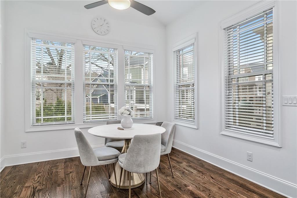 333 Patterson Way N East Atlanta, GA 30312 - Photo 12 of 47 a dining room with furniture a chandelier and wooden floor