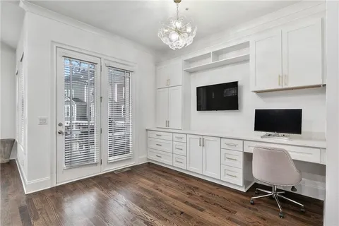 a living room with furniture and a ceiling fan