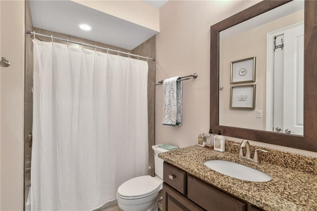 333 Patterson Way N East Atlanta, GA 30312 - Photo 27 of 47 a bathroom with a granite countertop sink toilet and shower
