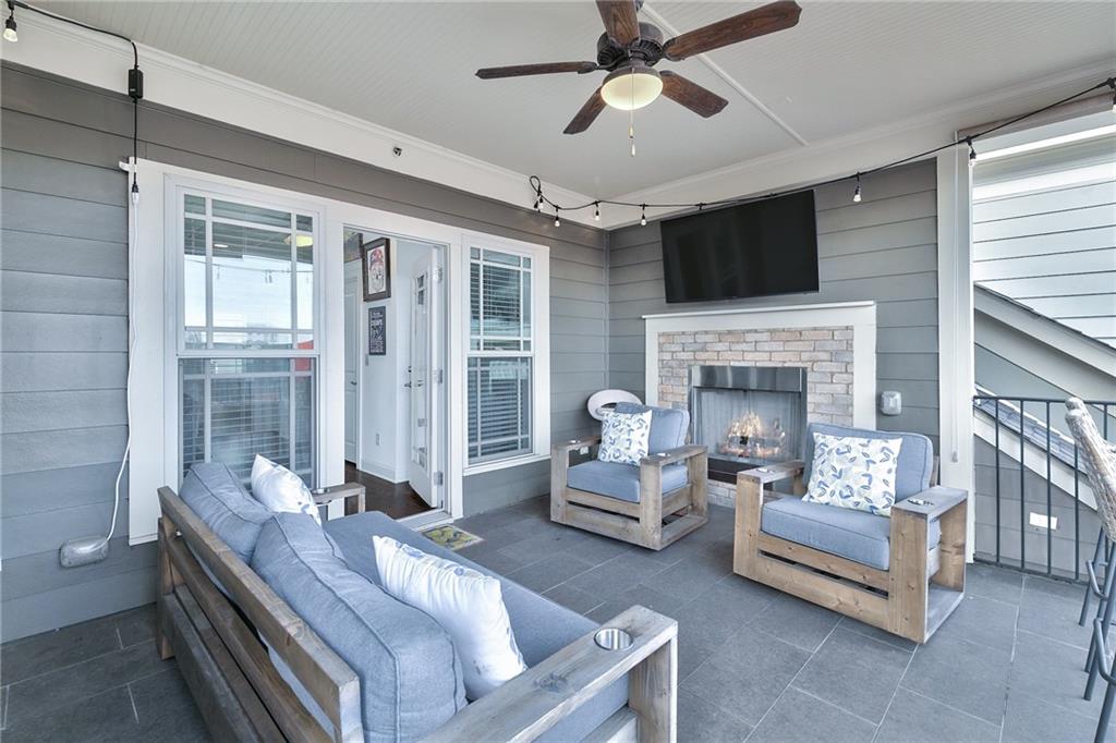 333 Patterson Way N East Atlanta, GA 30312 - Photo 38 of 47 a living room with furniture a flat screen tv and a fireplace