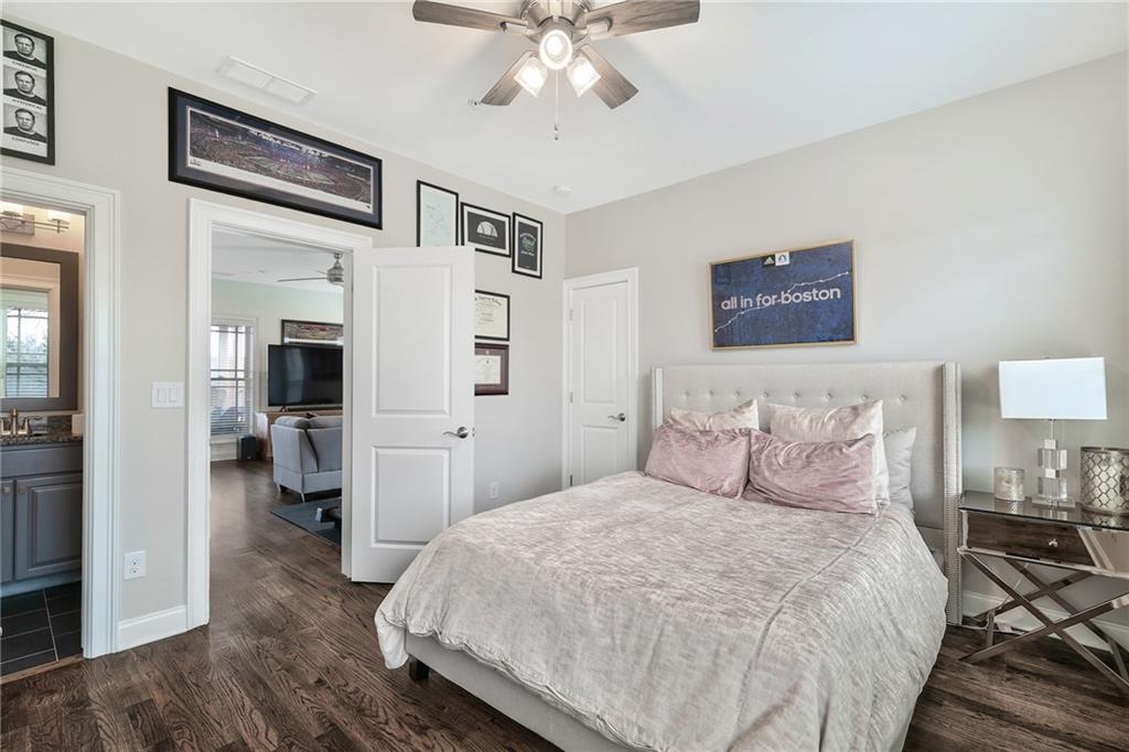333 Patterson Way N East Atlanta, GA 30312 - Photo 43 of 47 a bedroom with a large bed and a chandelier