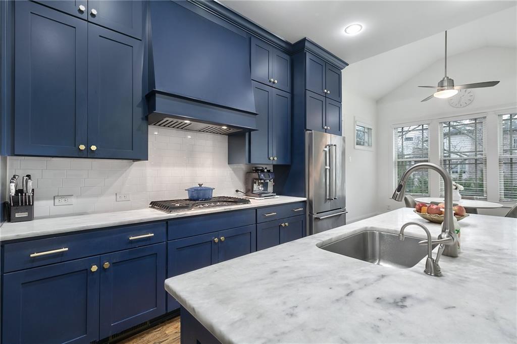 333 Patterson Way N East Atlanta, GA 30312 - Photo 10 of 47 a kitchen with granite countertop a sink stainless steel appliances and cabinets