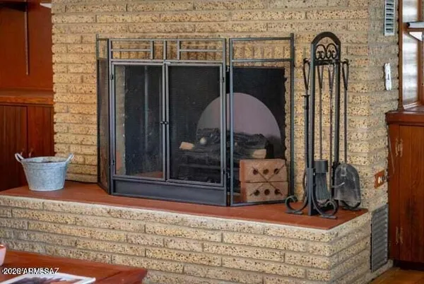 a view of living room cabinets and a fireplace